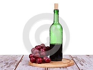 red wine, bottle of wine and grapes isolated over white background