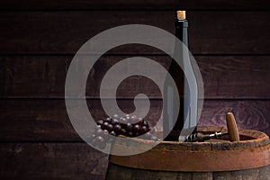 Red wine bottle  on wodden barrel