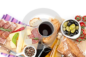 Red wine with cheese, prosciutto, bread, vegetables and spices