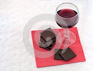 Red wine and chocolate on napkin,serviette.