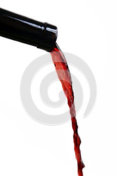 Red wine coming out the bottle photo