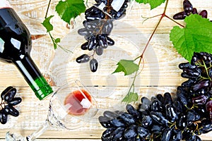 Red wine concept with bottle, glass and grapes