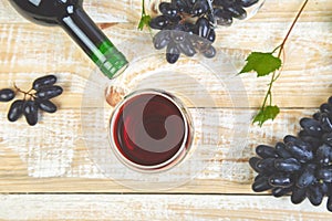 Red wine concept with bottle, glass and grapes