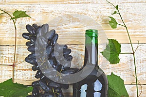 Red wine concept with bottle, glass and grapes