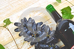 Red wine concept with bottle, glass and grapes