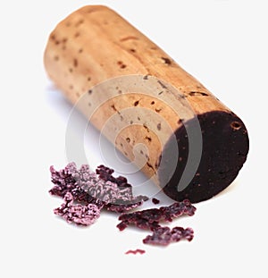 red wine cork and dry crystallized wine sediment on a white background