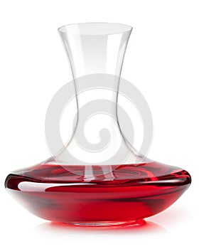 Red wine on a decanter on a white background