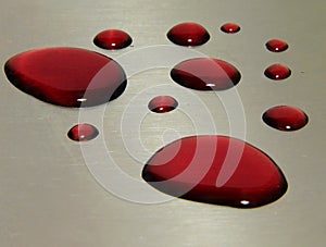 Red wine drops on a metal