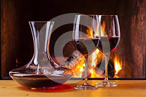 Red wine at fireplace with decanter photo