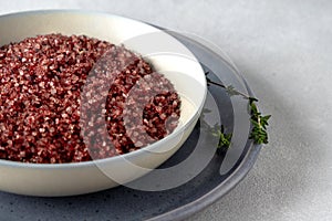 Red wine flavored salt in a bowl. Gourmet condiment to aromatize and season food