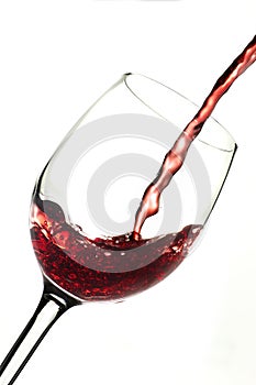 Red wine into glass photo