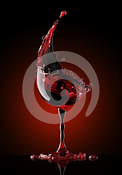 Red wine glass on black background