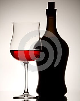 The red wine glass and bottle