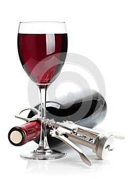 Red wine glass, bottle and corkscrew