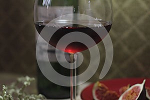 Red wine glass wine bottle figs