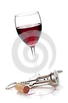 Red wine glass, cork and corkscrew