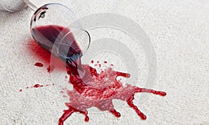 Red wine glass dirty carpet. photo