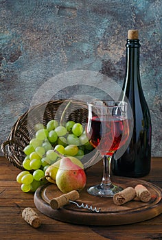 Red wine in glass and fruit