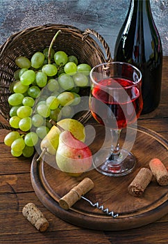 Red wine in glass and fruit