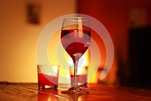 Red wine in glass with a living room background
