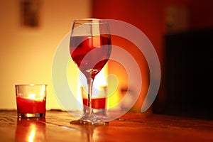 Red wine in glass with a living room background