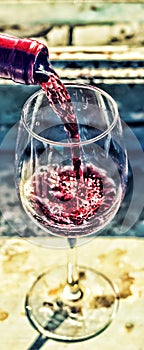 Red wine in a glass. Sommelier pouring the wine into the glass. valentine`s day, date, love, Celebration Thanksgiving, Christmas,