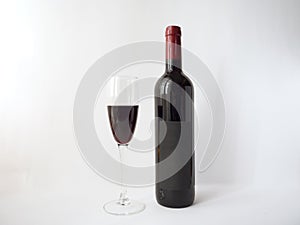 Red wine in a glass on white background