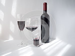 Red wine in a glass on white background