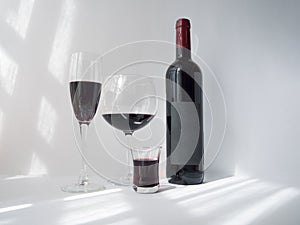 Red wine in a glass on white background