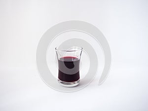 Red wine in a glass on white background