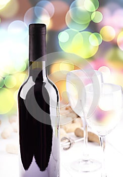 The Red wine glasses, bottle and corks. Isolated on colored background