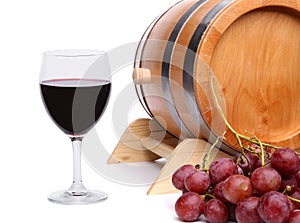 Red wine, grapes and old barrel