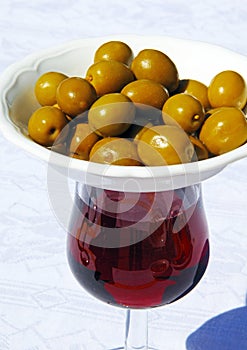 Red wine and green olives.