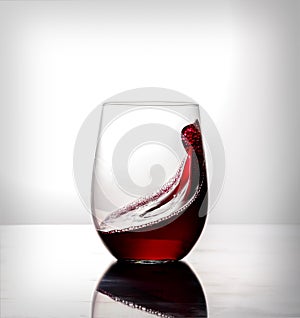 Red wine moving in glass