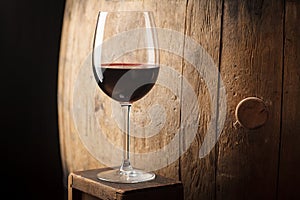 Red wine near a barrel