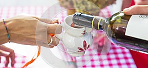 Red wine poured into ceramic jug