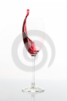 Red wine poured from a glass. tableware for drinks