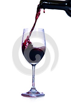 Red wine pouring from bottle