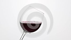 Red Wine Is Pouring Into A Glass