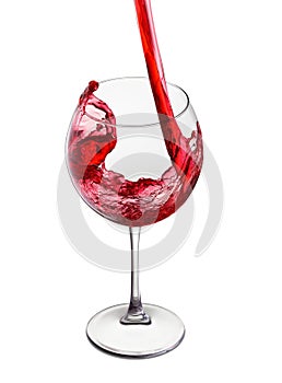 Red wine pouring into glass