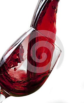Red wine pouring into glass