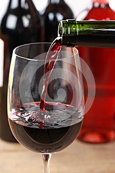 Red wine pouring into a glass