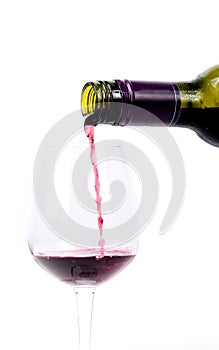 Red wine pouring into a glass