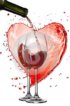 Red wine pouring into glasses against heart of splash