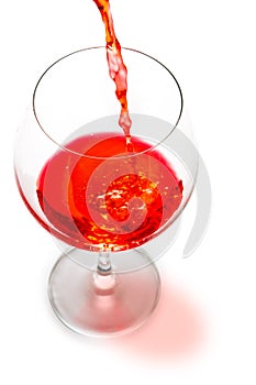 Red wine pouring isolated