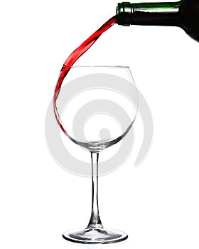 Red wine pouring on white background