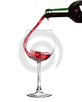 Red wine pouring on white background