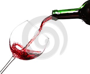 Red wine pouring on white background