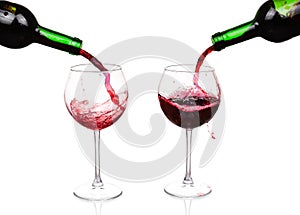 Red wine pouring on white background