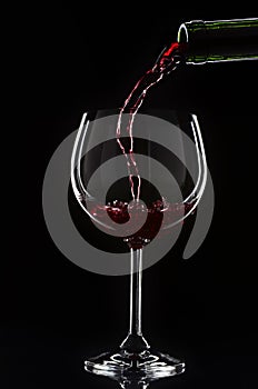 Red wine pouring into a wine glass